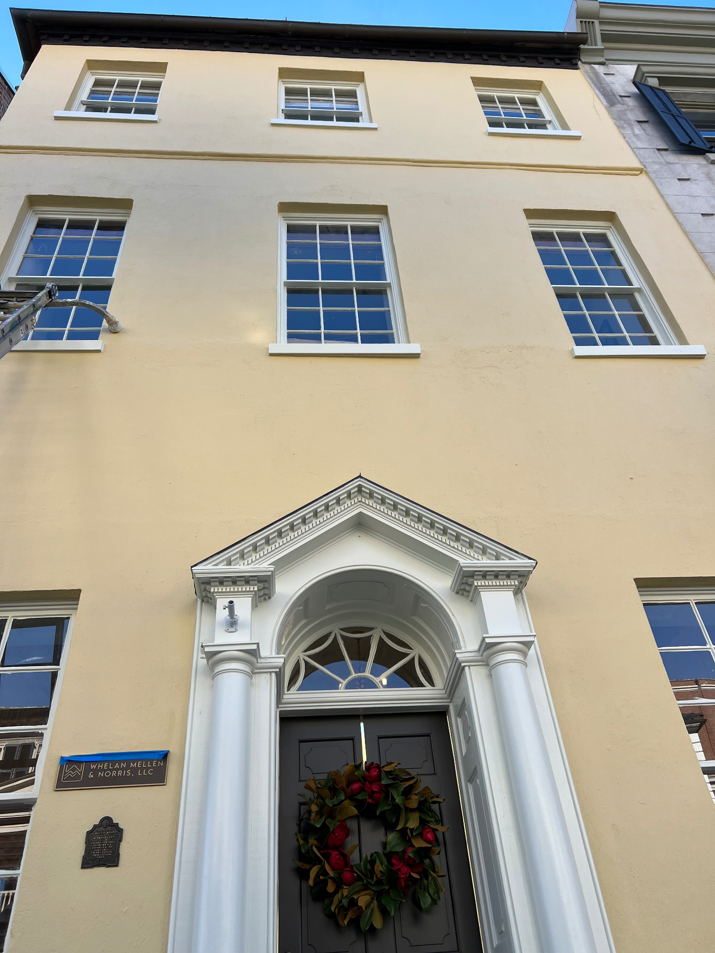 Fresh stucco repaint — downtown facade