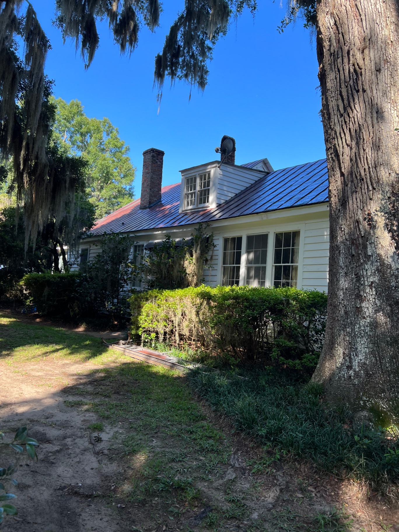 Restored historic cottage under the oaks